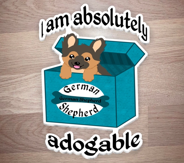 Stack of stickers of German Shepherd puppy in a box text around it saying - I am absolutely adogable